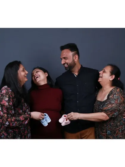 A candid moment of shared laughter during a family portrait session. My approach is to make you feel comfortable and forget the camera is there, so we can capture your family's genuine happiness.