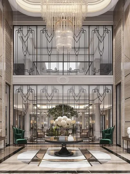 We designed this double-height foyer as a grand welcome. The space is defined by book-matched marble walls and a magnificent crystal chandelier, establishing a narrative of timeless grandeur and neoclassical elegance from the moment you step inside.