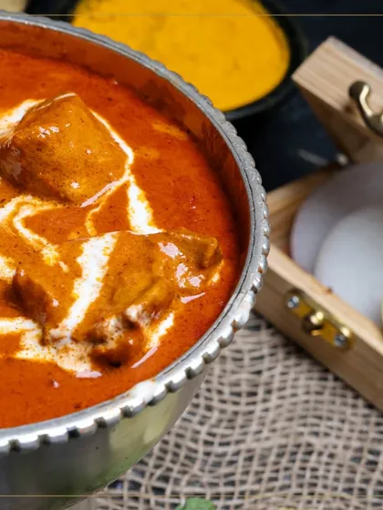 Our Mutton Nizamuddin, a dish that balances rich spices with creamy luxury, served with fresh garnishes.