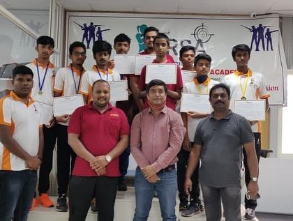 The male winners of our 2020 academy competition posing with their certificates and medals alongside the coaches.