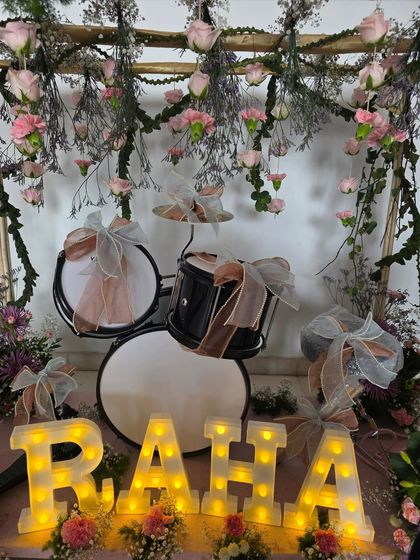 The beautiful floral drum set for Raha Kapoor, daughter of Alia Bhatt and Ranbir Kapoor, featuring her name in marquee lights.