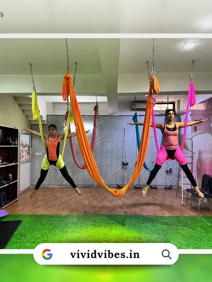 Learn to spread your wings and fly high with your tribe. This image shows two students practicing in sync, demonstrating the connection we build.
