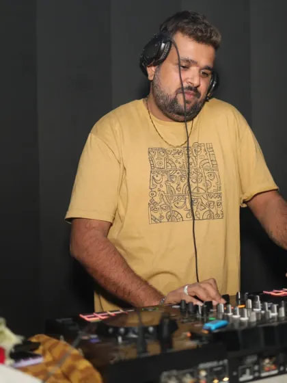 Focused on the mix at Bangtan Lounge in Mira Road. I'm reading the room and lining up the next track to keep the party going.