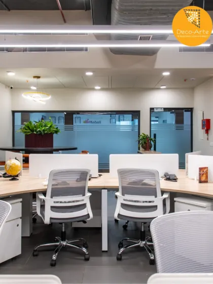 An open and collaborative workstation area at the Brandman office. The layout is designed to encourage connection, with clean aesthetics and ample greenery to promote workplace wellness.