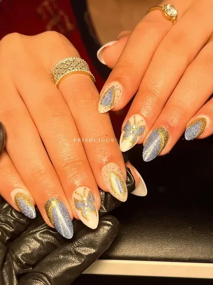 Glitz and glam with this butterfly-themed set. I used a combination of blue cat eye glitter and gold glitter to create this sparkling design.