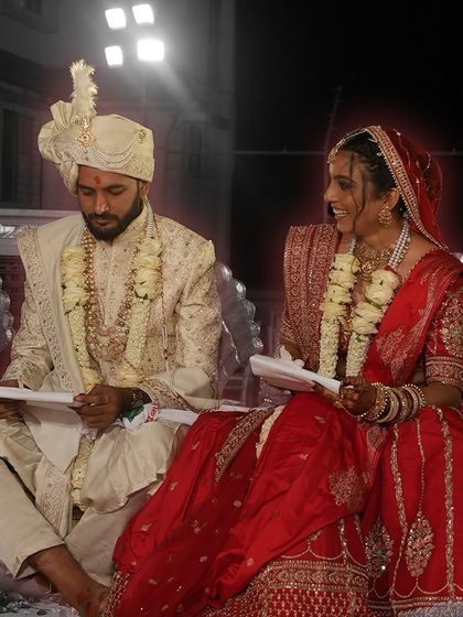 Weddings are about more than just rituals; they're about personal promises. This moment, where the couple reads letters to each other during the ceremony, is a beautiful example of the unique, heartfelt stories we love to capture.