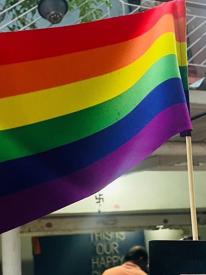 A rainbow flag waving proudly outside our kitchen. It's a symbol of our commitment to being an inclusive and welcoming space for all.
