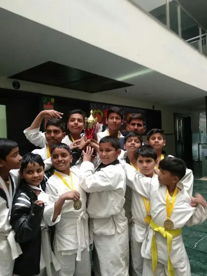 A moment of celebration for our junior team after winning a tournament. Success is a team effort, and we are proud of the hard work these young martial artists put in.