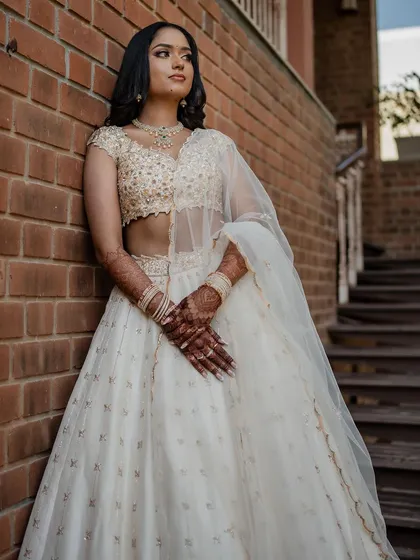 A modern, chic portrait against a brick wall.