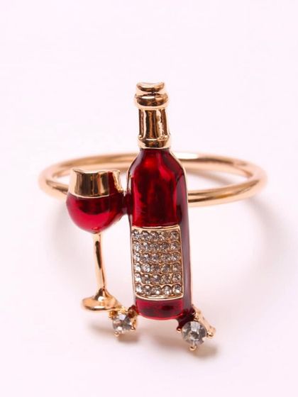 For the wine lover, this playful napkin ring features a miniature wine bottle and glass. It's a fun, quirky detail that is perfect for dinner parties, wine tastings, or as a unique gift.