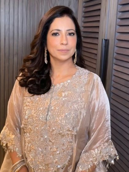 We love creating these bouncy, face-framing curls. This style adds so much glamour and is perfect for a mature client who wants to look elegant and festive.