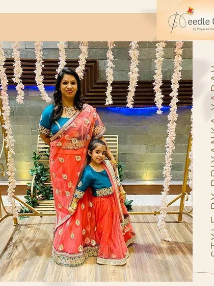 There's nothing more special than matching with your little one. I designed this mother-daughter ethnic wear set, coordinating the colors and embroidery on the lehenga and saree for a beautiful, unified look at a family wedding.