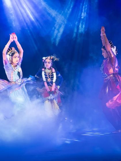 Dancers emerge from a mystical fog, depicting a celestial scene from Krishna's life. The interplay of light and atmosphere is something I choreograph carefully to transport the audience to Vrindavan.