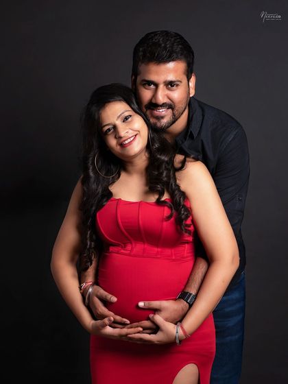 The comfort and safety in his arms. This pose is all about the support and love that surrounds the mother-to-be during her pregnancy.