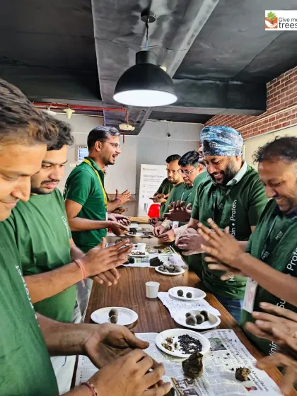 The Amdocs and Nxtra teams are all smiles as they roll seed balls. Our workshops are designed to be engaging, interactive, and a great break from the office routine.