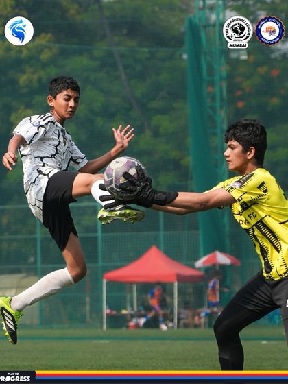 A brave goalkeeper comes out to challenge a forward for the ball. We train our keepers to be commanding and fearless.