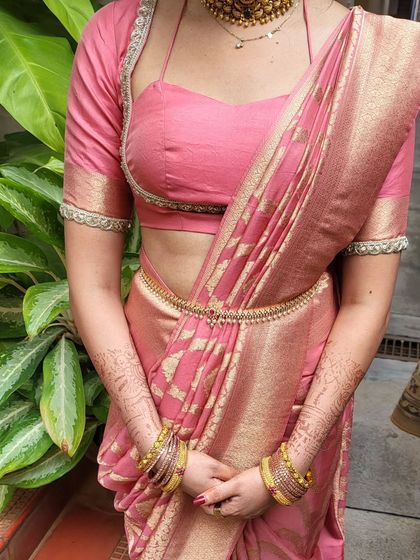 A close-up of the body-hug drape, showing the neat pleats and how the fabric is contoured to the body. This style is secured to stay in place all day.