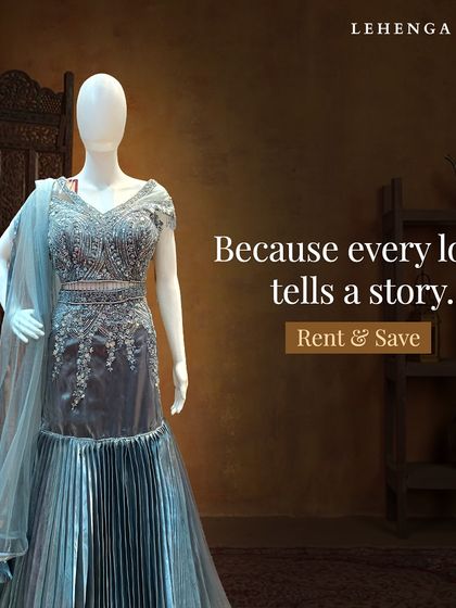 Because every look tells a story. This grey-blue mermaid gown with a pleated skirt and embellished bodice is a modern and chic option for a cocktail party.