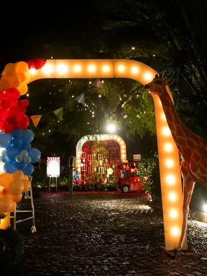 Step right up! This nighttime carnival entrance, complete with a towering giraffe and glowing archway, set the stage for an evening of fun and excitement. I specialize in creating dramatic, attention-grabbing entries that build anticipation from the moment guests arrive.