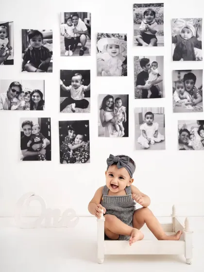 I love creating concepts that tell a story. For this little girl's first birthday, we created a beautiful wall gallery of her first year in monochrome prints, making her the star of her own life story.