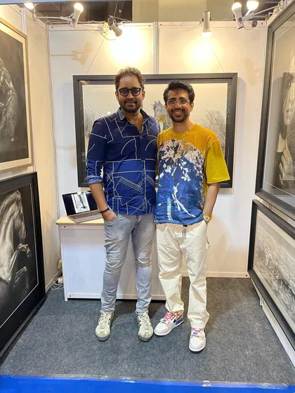 Another visitor at my exhibition booth. I enjoy engaging with fellow art enthusiasts and discussing the techniques behind my work.