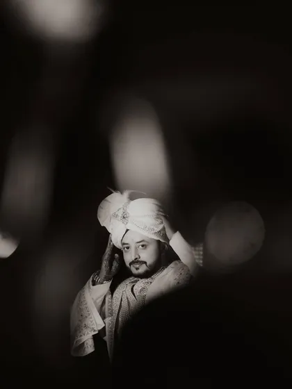 The groom's anticipation is a powerful part of the story. This artistic, black and white portrait of Ananta at Hotel Silver Spoon captures the quiet moments of reflection before he begins his new chapter.