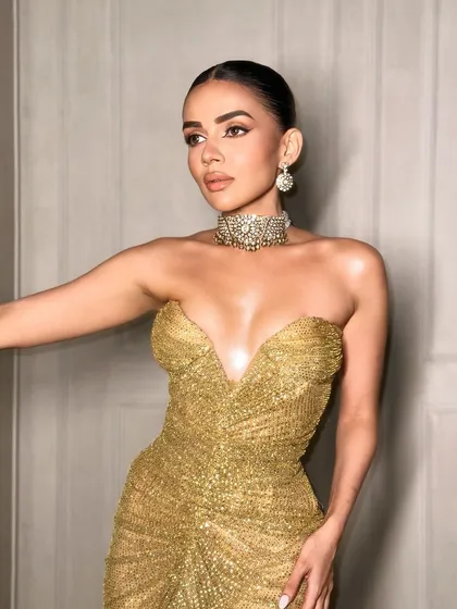 Another angle of this golden look. The makeup is all about that wet, glossy skin finish.