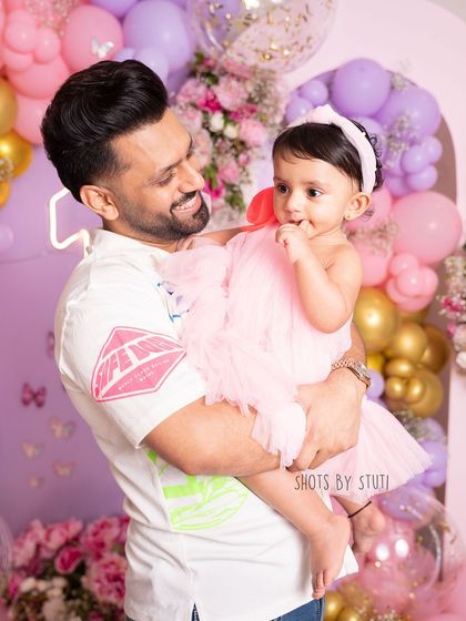 A proud papa with his birthday girl. These father-daughter moments during a milestone session are always so special to capture.