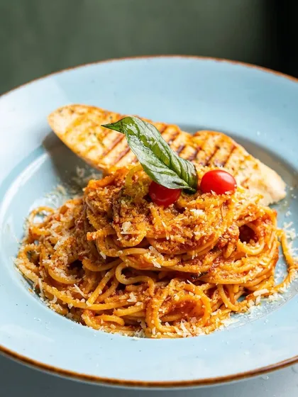 Sometimes, the simplest dishes are the most profound. Our Nonna’s Tomato Basil Spaghetti is a timeless classic, prepared with fresh ingredients and plated beautifully to be an absolute crowd-pleaser.
