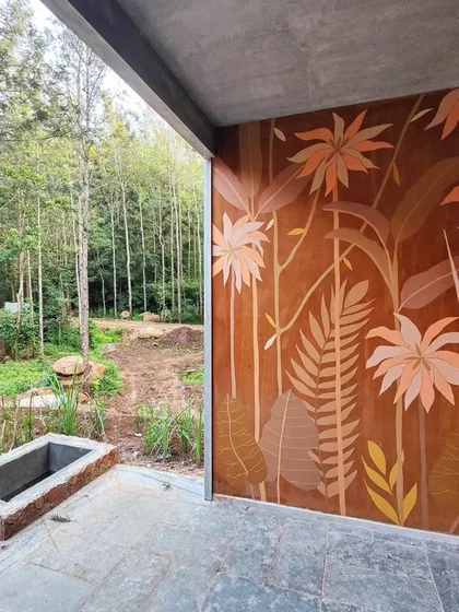 I love how this earthy, terracotta-toned mural blends seamlessly with the natural surroundings. Using a warm, neutral palette, I can create botanical art that feels like it grew right out of the wall.