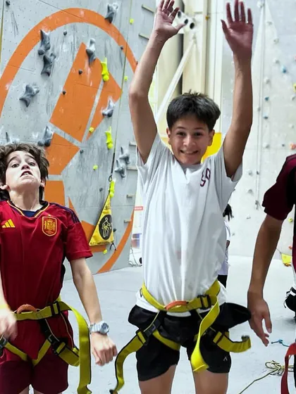 The pure joy of a school outing! These students are excited and ready to take on the climbing challenges after their initial briefing.