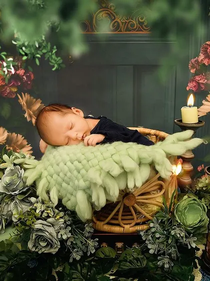 Another angle of the enchanted forest theme, showing the baby peacefully sleeping amidst lush greenery and twinkling lights.