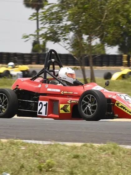 The number 21 car at speed, a symbol of our successful driver progression program.
