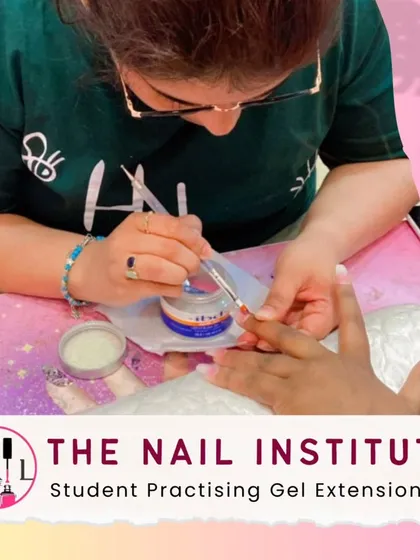 A student gets hands-on practice with gel extensions, learning how to build the nail shape and ensure a strong, lasting bond.