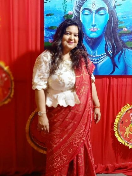 Here I am in a custom-designed peplum blouse paired with a traditional red saree. I believe fashion and elegance are every lady's birthright.