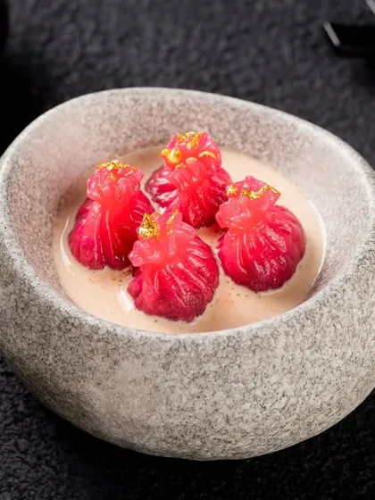 A more modern plating of dim sum in a stone bowl. This shows versatility in styling, from traditional to contemporary, for the same client.