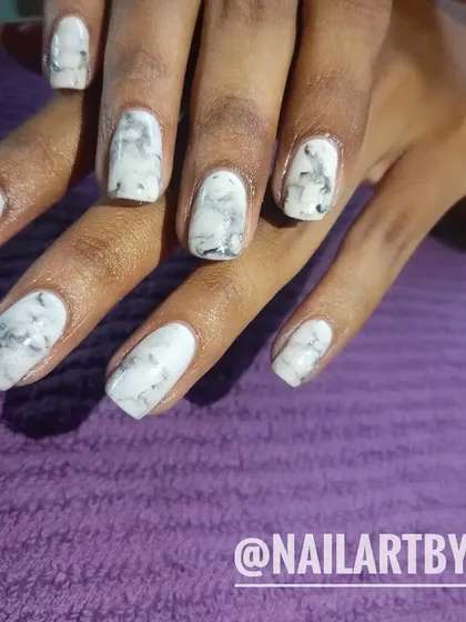 A classic white and grey marble design for a sophisticated and timeless look that mimics real stone.