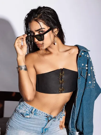A powerful shot from an editorial denim series I directed. The goal was to create a bold, high-fashion look using everyday materials. I focused on a wet-hair look, a statement leather corset, and a pearl-studded denim jacket to blend raw texture with a touch of glamour.