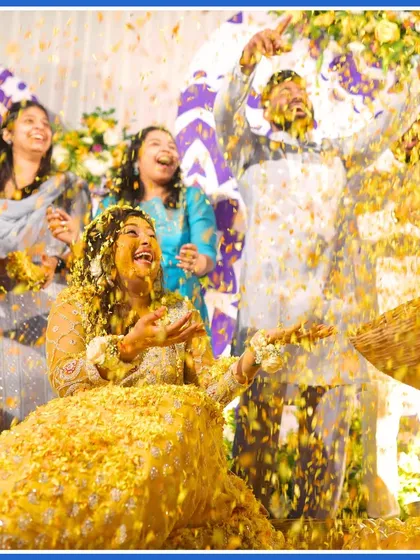 The bride enjoying a shower of flower petals from her family and friends. A moment of pure, unscripted joy.