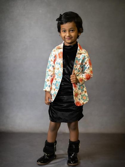 A stylish portrait of a confident young girl. We also photograph older kids, capturing their unique personality in a more classic portrait style.