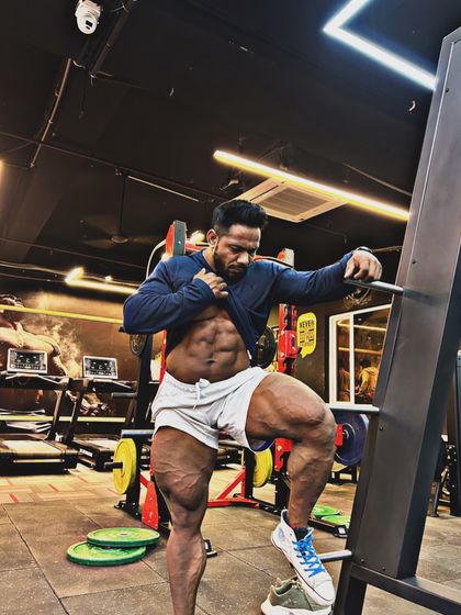 Consistency is everything. A shot showing the abs and quads, a result of daily habits.