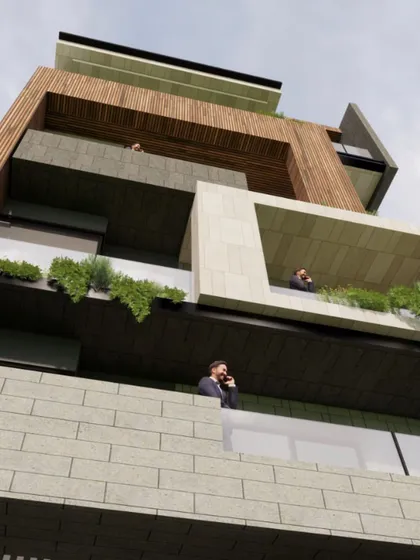 A ground-level view looking up at a facade with linear voids and stucco textures. This perspective emphasizes the depth of the balconies and the interplay of light and shadow on the textured surfaces.