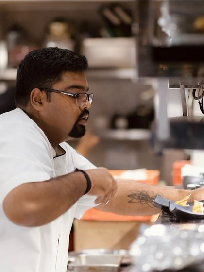 A chef in the midst of service, focused and dedicated to his craft. The tattoo on his arm is a hint of the personality and passion that our team brings to the kitchen.