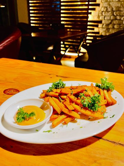 You can't go wrong with perfectly crispy and seasoned french fries, served with a creamy dip.