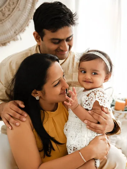 A tender moment between parents and their baby girl. These quiet, loving interactions create some of the most beautiful and emotive family portraits.
