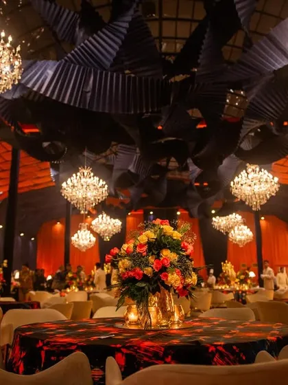 A view across the dining area, showing how the chandeliers and table centerpieces created a galaxy of lights throughout the large venue.