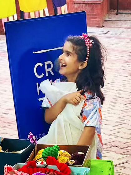 The pure, uninhibited joy of childhood. This photo captures the magic I hope to inspire with my handmade toys.