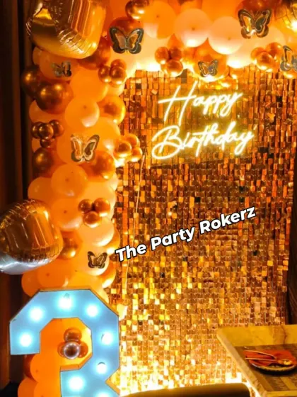 A close-up of the 13th birthday decor, highlighting the shimmer of the sequin wall and the warm glow of the neon sign and marquee number.