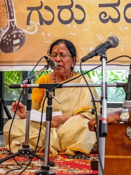 Another view of a senior student deep in her musical offering. Her presence reminds us that this practice is a lifelong journey of learning and devotion.