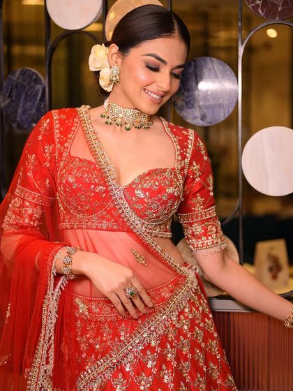 A smile that lights up the room. This shot captures the joy of the bride, with her makeup looking fresh and radiant throughout the celebration.
